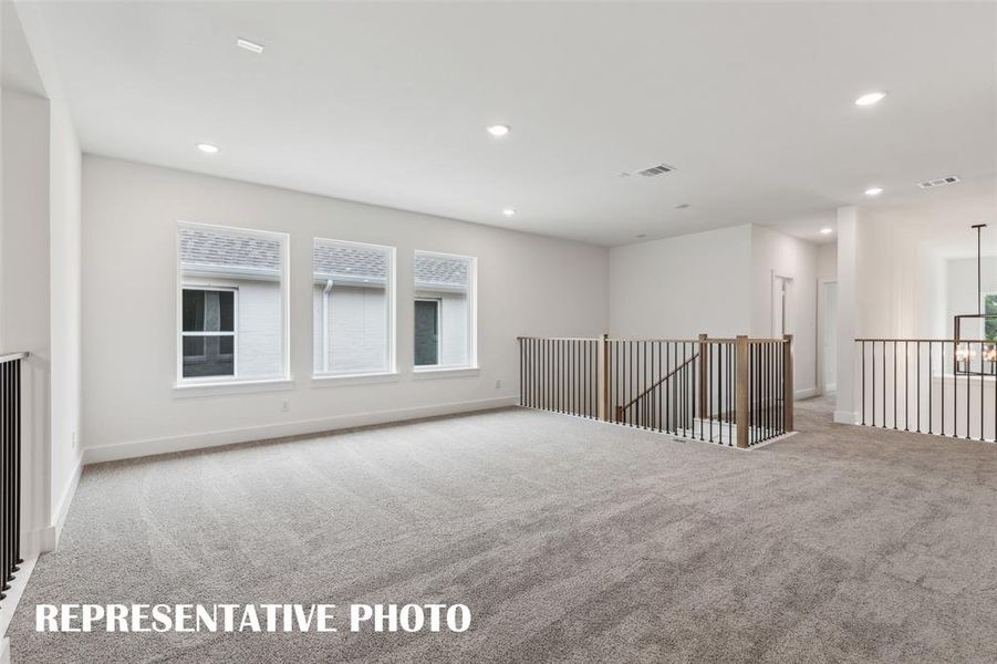 This spacious, light filled game room is the perfect place to host those big game day parties!  REPRESENTATIVE PHOTO