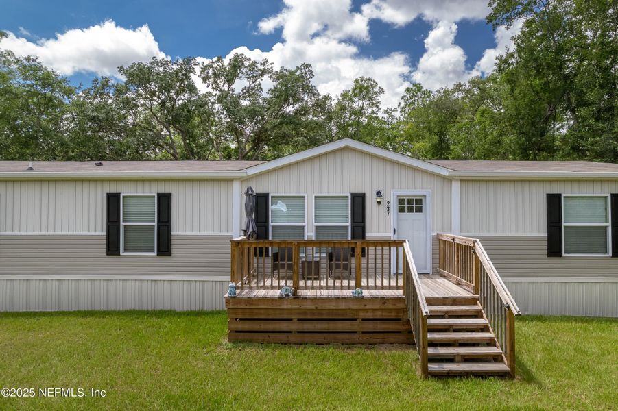 Front exterior of a new home in , Pomona Park, FL, highlighting curb appeal (Image 17).