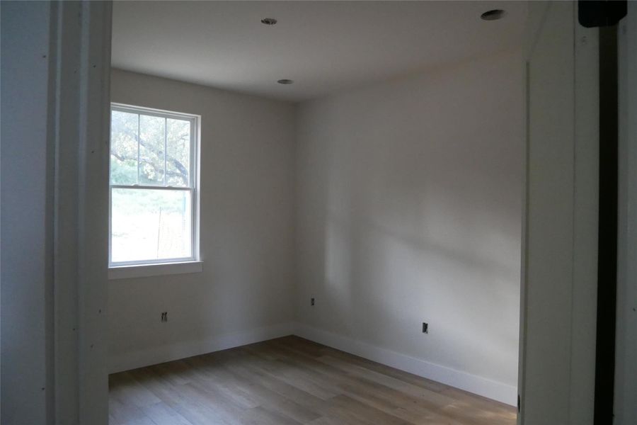 Spacious secondary bedroom with luxury vinyl plank flooring and ample natural light. Spacious secondary bedroom with luxury vinyl plank flooring and ample natural light.