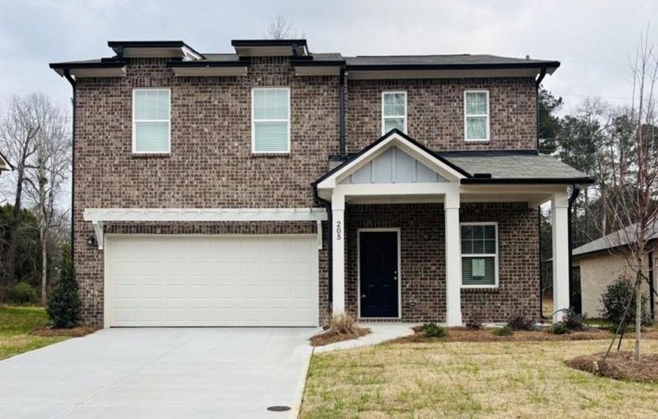 Front exterior of a new home in Kendall Grove, McDonough, GA, highlighting curb appeal (Image 2). Front exterior of a new home in Kendall Grove, McDonough, GA, highlighting curb appeal (Image 2).