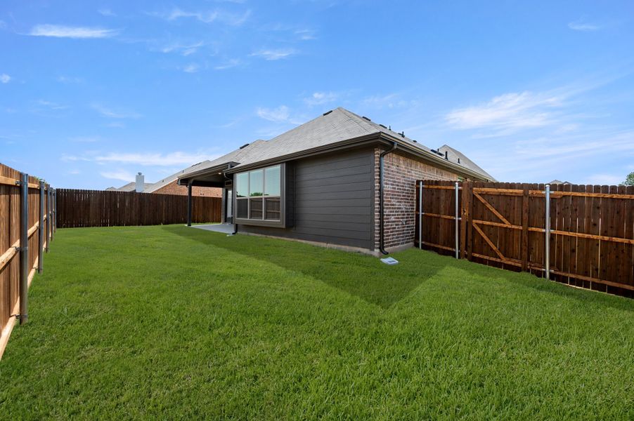 Exterior details and patio area of a home in Pirate Village, Granbury (Image 20).
