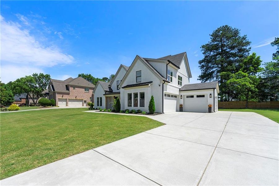 Front exterior of a new home in , Dacula, GA, highlighting curb appeal (Image 23).
