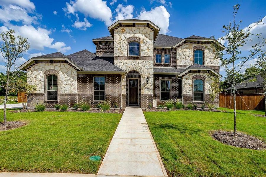 View of front of house with a front lawn