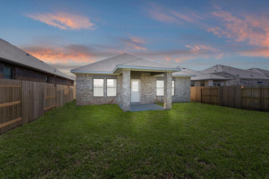 Exterior details and patio area of a home in Windrose Green, Angleton (Image 3).