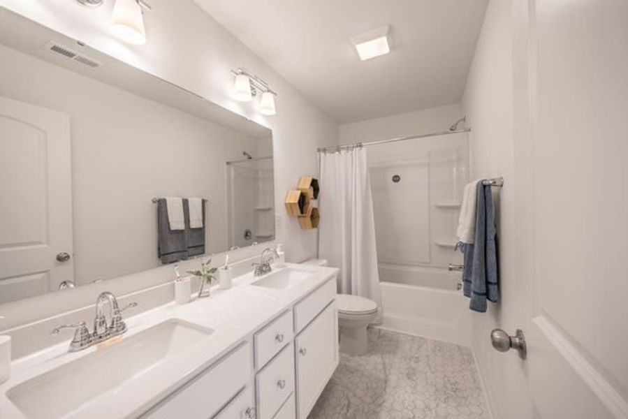 Representative furnished interior of a home built from the Hudson by True Homes in Whispering Hills, Locust (Image 18).