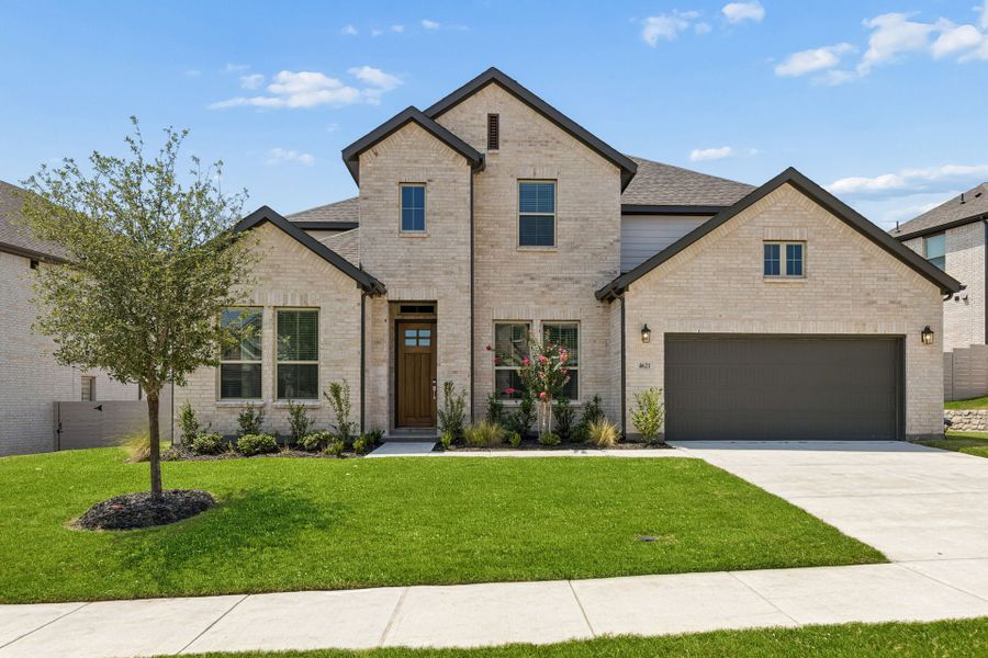 Front exterior of a new home in Painted Tree Lakeside, McKinney, TX, highlighting curb appeal (Image 1). Front exterior of a new home in Painted Tree Lakeside, McKinney, TX, highlighting curb appeal (Image 1).