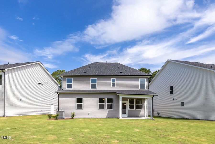 Front exterior of a new home in Woodland Crossing, Zebulon, NC, highlighting curb appeal (Image 2).