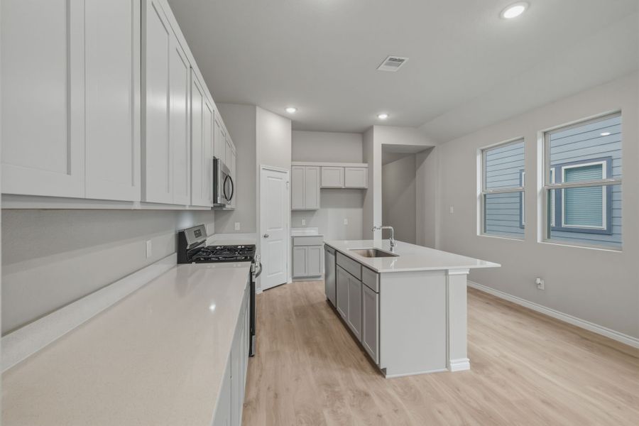 Kitchen in the Cedar home plan by Trophy Signature Homes – REPRESENTATIVE PHOTO Kitchen in the Cedar home plan by Trophy Signature Homes – REPRESENTATIVE PHOTO