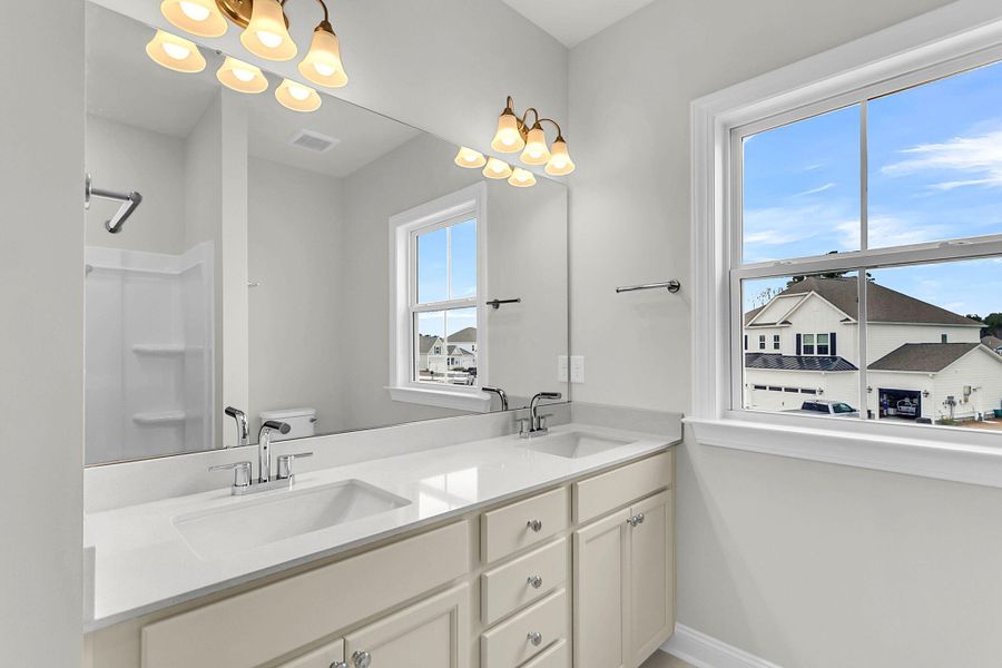 Furnished interior view inside a new home in Tidewater at Lakes of Cane Bay, Summerville (Image 11).