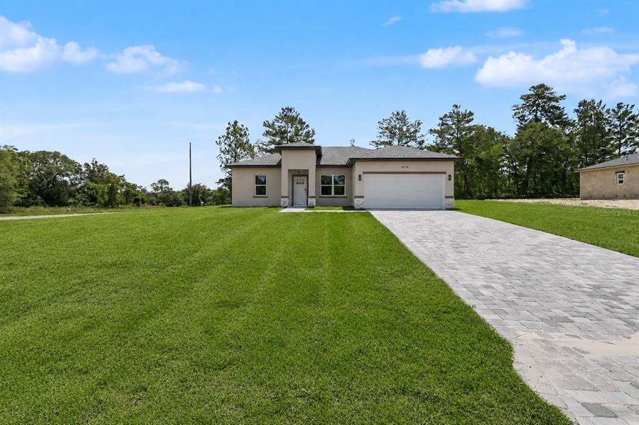 Front exterior of a new home in , Citrus Springs, FL, highlighting curb appeal (Image 20).