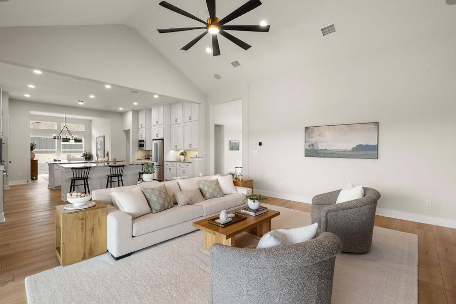 Open living space flowing seamlessly into the kitchen and dining areas.