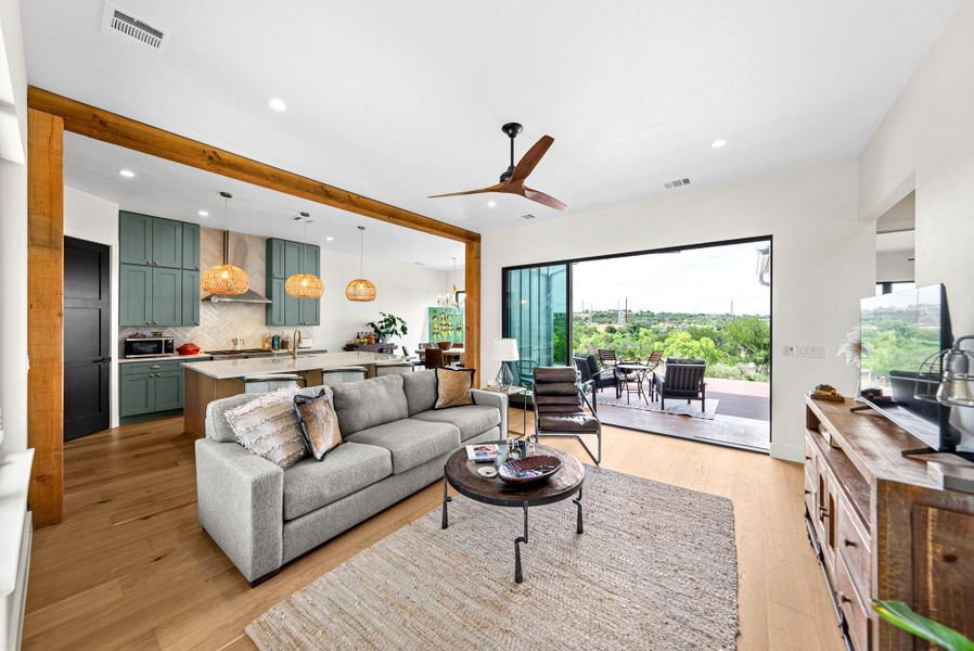 Warm wood accents complement the airy open design leading out to a terrace.