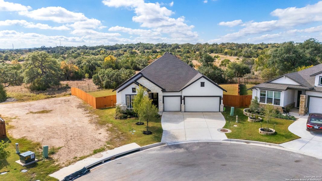 Front exterior of a new home in Meyer Ranch – Legacy Series, New Braunfels, TX, highlighting curb appeal (Image 1).