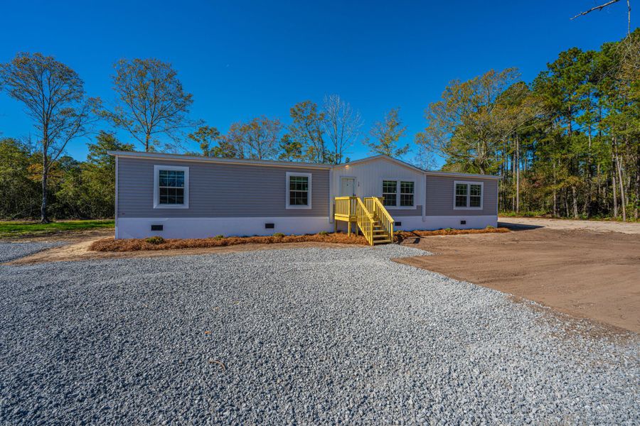 Exterior details and patio area of a home in , Pinopolis (Image 17).