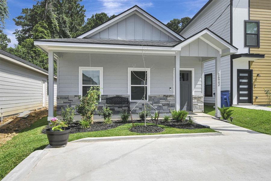 Front exterior of a new home in Lake Conroe Village, Montgomery, TX, highlighting curb appeal (Image 20).