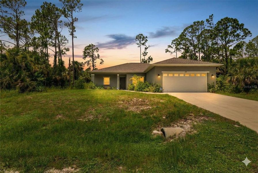 Front exterior of a new home in , North Port, FL, highlighting curb appeal (Image 25).
