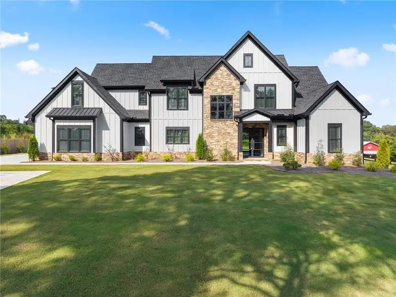 Front exterior of a new home in , Cumming, GA, highlighting curb appeal (Image 27).