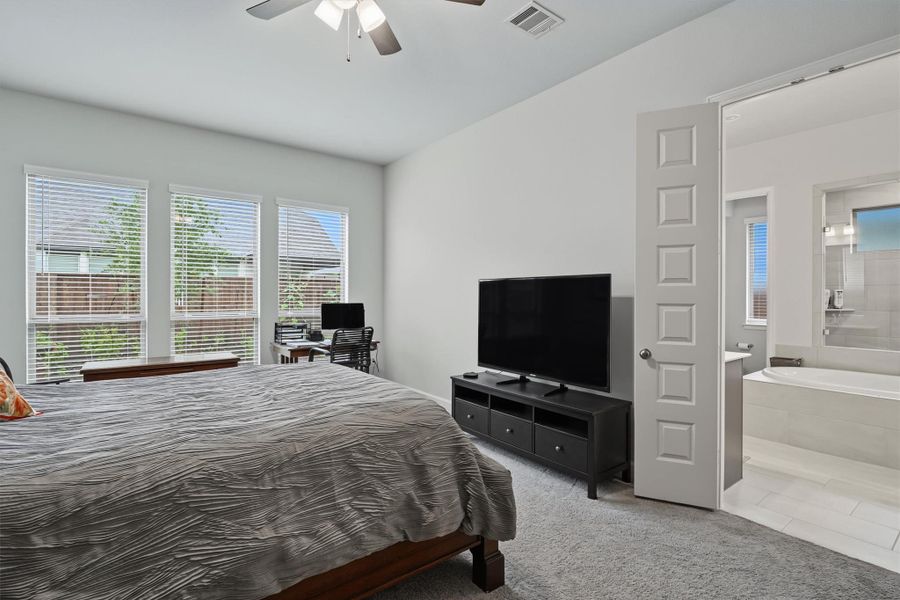 Primary bedroom featuring en suite Primary bedroom featuring en suite