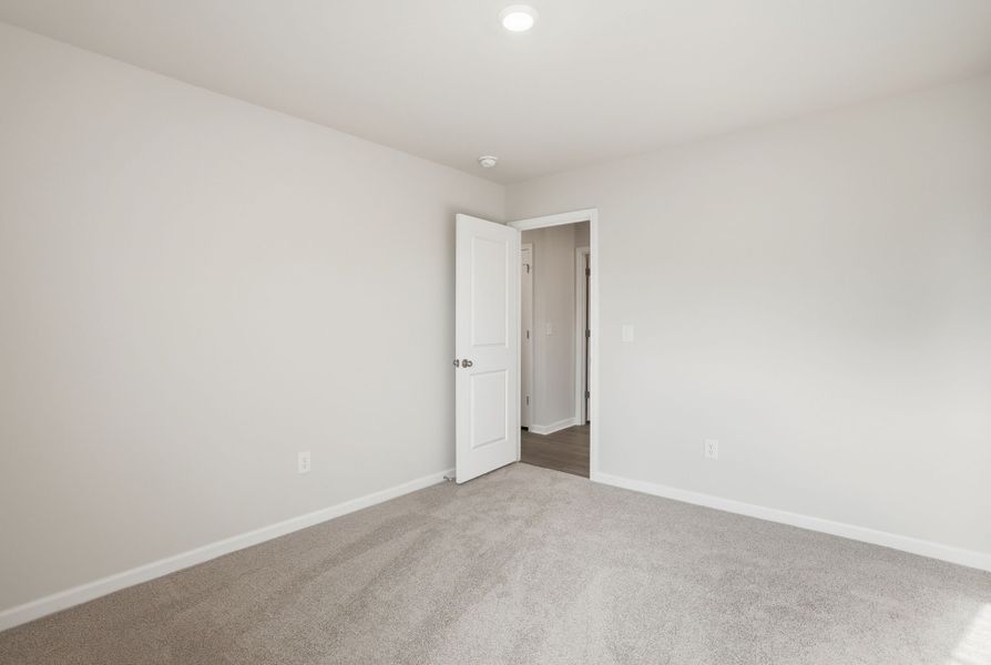Representative unfurnished interior of a home built from the Juniper B by McGuinn Homes in Hunters Branch, Hopkins (Image 39).