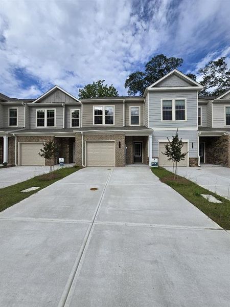 Front exterior of a new home in Morning Creek Forest, South Fulton, GA, highlighting curb appeal (Image 1).
