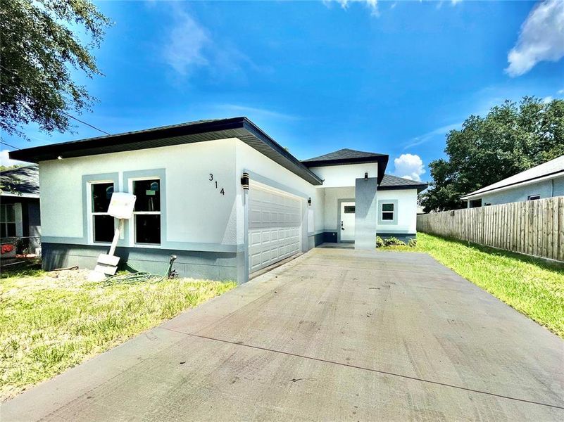 Front exterior of a new home in , Ocoee, FL, highlighting curb appeal (Image 1). Front exterior of a new home in , Ocoee, FL, highlighting curb appeal (Image 1).