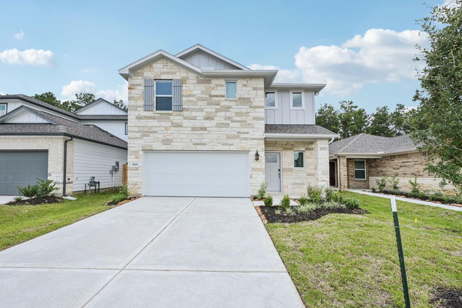 Front exterior of a new home in Landing Meadows - Traditional Series, New Caney, TX, highlighting curb appeal (Image 23).