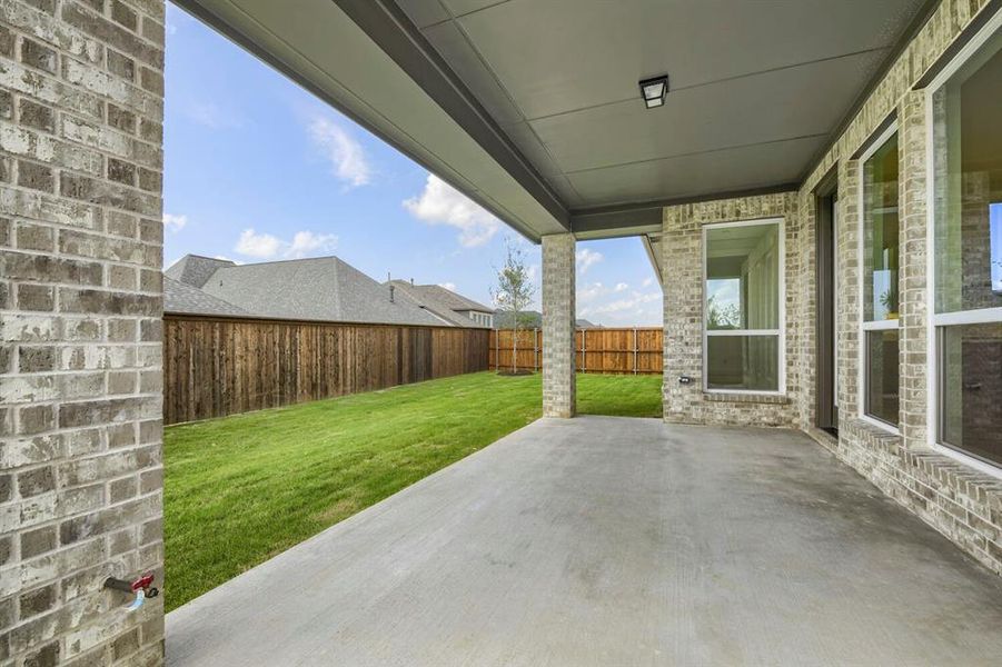 Covered concrete patio with a recessed ceiling light Covered concrete patio with a recessed ceiling light