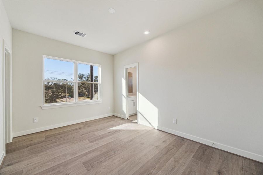 Bright secondary bedrooms offer flexible space for guests, family, or a private work-from-home setup.