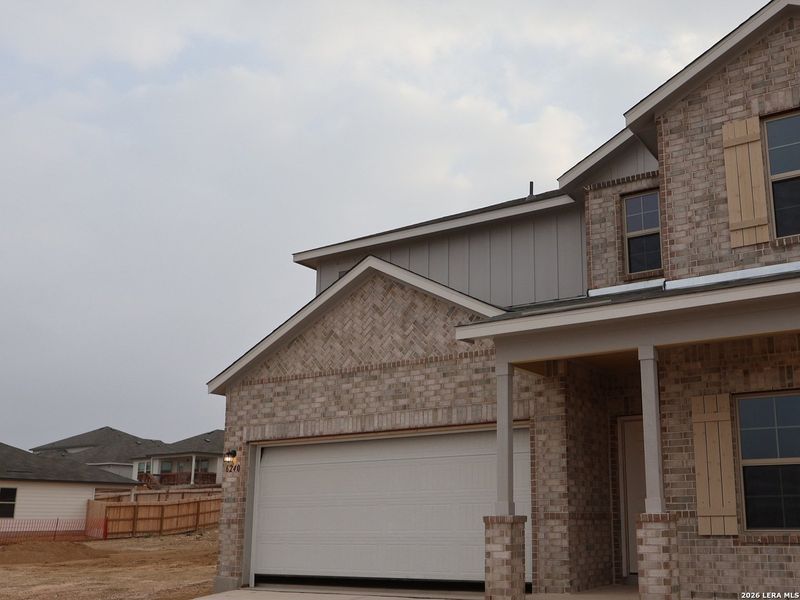 Front exterior of a new home in Mesquite Ridge, San Antonio, TX, highlighting curb appeal (Image 21).