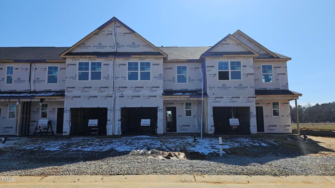 Front exterior of a new home in Springvale, Fuquay Varina, NC, highlighting curb appeal (Image 55).