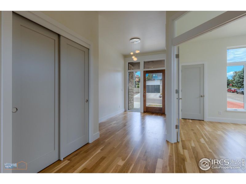 Entry. Large Front Door With Glass Sidelight And Transom Windows.