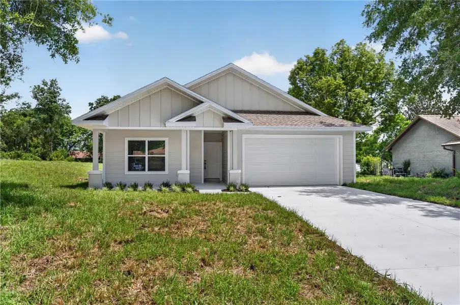 Front exterior of a new home in , Deltona, FL, highlighting curb appeal (Image 2). Front exterior of a new home in , Deltona, FL, highlighting curb appeal (Image 2).