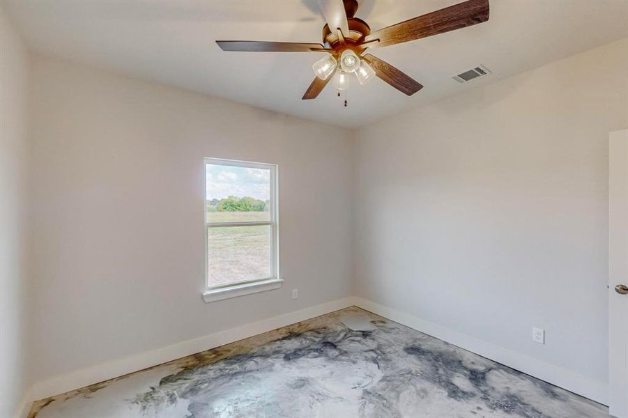 Spare room featuring ceiling fan