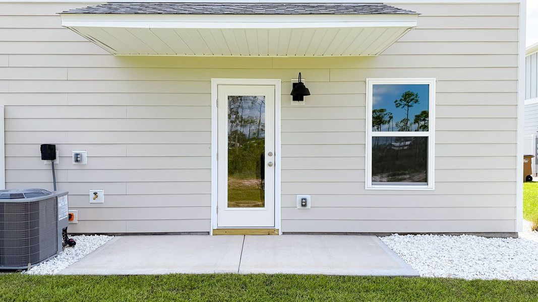 Exterior details and patio area of a home in WindMark Beach, Port Saint Joe (Image 4).