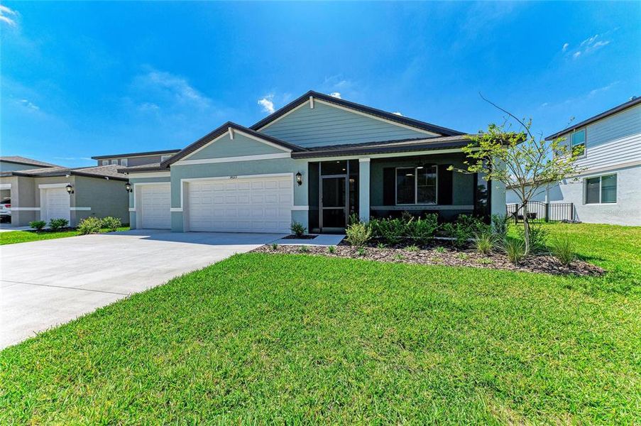 Front exterior of a new home in , Parrish, FL, highlighting curb appeal (Image 2). Front exterior of a new home in , Parrish, FL, highlighting curb appeal (Image 2).