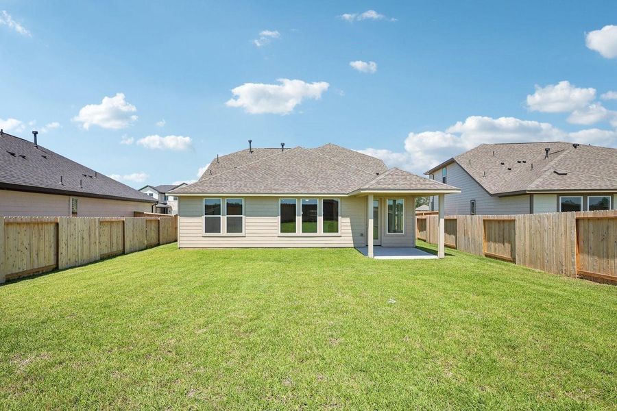 Spacious backyard with covered patio