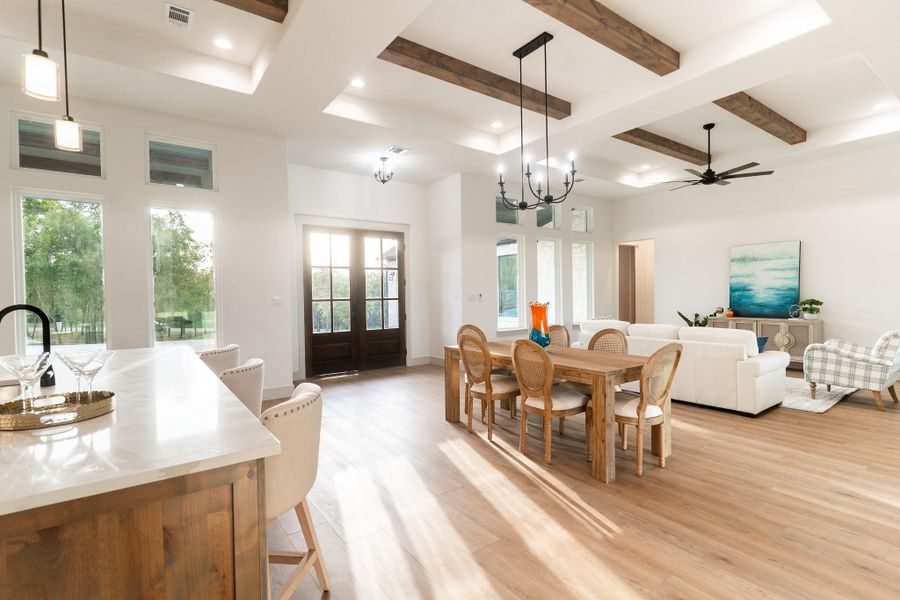 Dining room featuring beam ceiling, french doors, light wood-style floors, ceiling fan, and recessed lighting Dining room featuring beam ceiling, french doors, light wood-style floors, ceiling fan, and recessed lighting