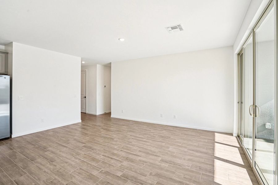 Great room with 4 panel slider. Representative images and renderings are for illustrative purposes. Actual structural options and design finishes of home may vary.