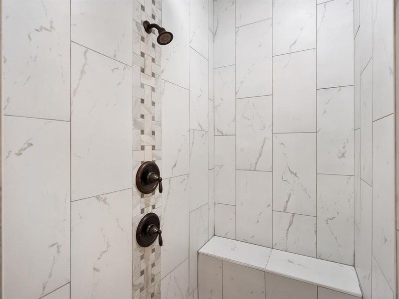 Bathroom featuring a tile shower