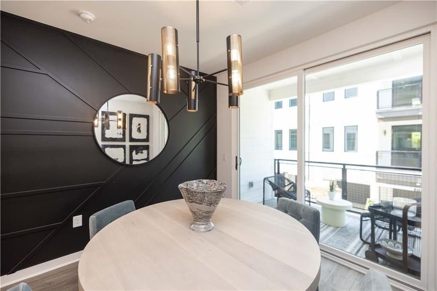 Light filled dining room each leading out to your covered patio. Not actual home. Photos of Model Home.