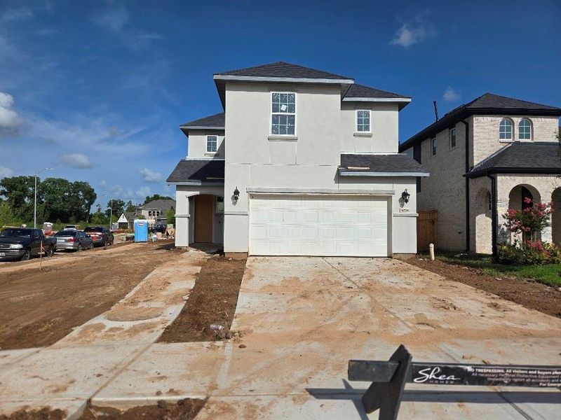Front exterior of a new home in Sienna 40', Missouri City, TX, highlighting curb appeal (Image 25). Front exterior of a new home in Sienna 40', Missouri City, TX, highlighting curb appeal (Image 25).