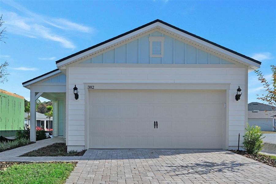 Front exterior of a new home in Seminole Palms, Palm Coast, FL, highlighting curb appeal (Image 17). Front exterior of a new home in Seminole Palms, Palm Coast, FL, highlighting curb appeal (Image 17).
