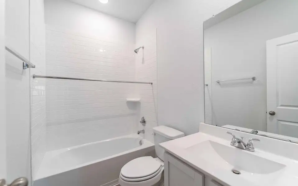 Furnished interior view inside a new home in The Pines at Seven Coves, Willis (Image 5).