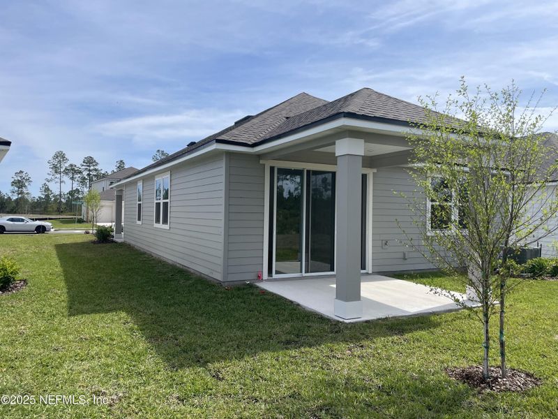 Exterior details and patio area of a home in Palm Series at Seminole Palms, Palm Coast (Image 27).