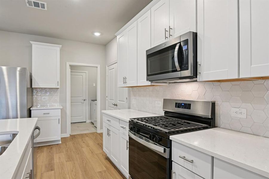 Furnished interior view inside a new home in Lakehaven - Spring Series, Farmersville (Image 13).