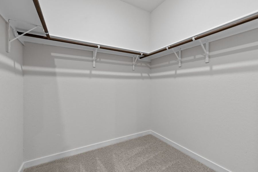 A white wall with a white floor.