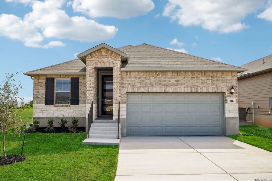 Front exterior of a new home in Legendary Trails - Premier Series, Cibolo, TX, highlighting curb appeal (Image 1). Front exterior of a new home in Legendary Trails - Premier Series, Cibolo, TX, highlighting curb appeal (Image 1).