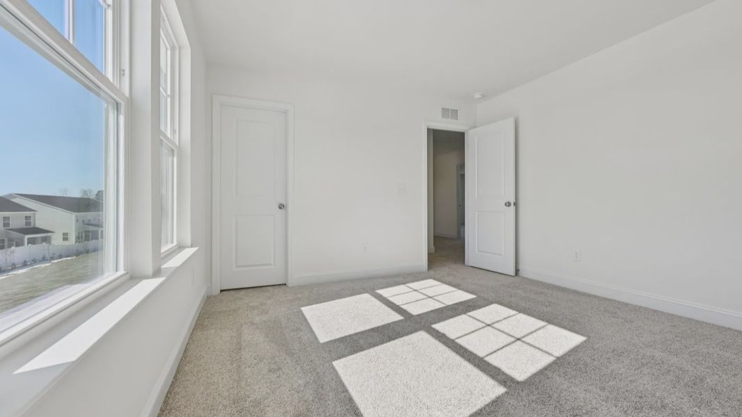 Furnished interior view inside a new home in Sidney Creek Single Family, Zebulon (Image 40).