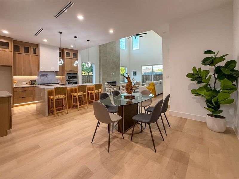Dining room featuring light wood-style floors and recessed lighting