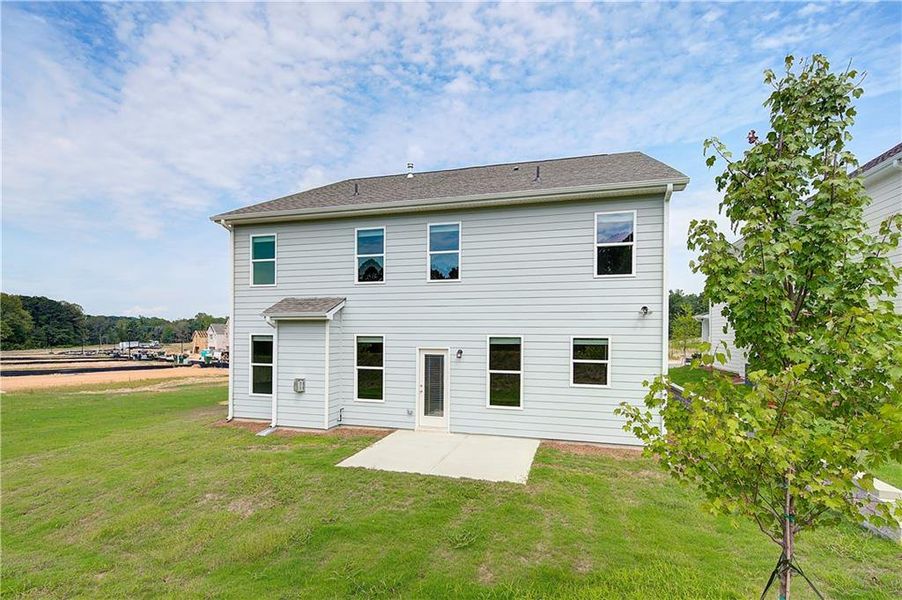 Front exterior of a new home in Abbotts Crossing, Conyers, GA, highlighting curb appeal (Image 15). Front exterior of a new home in Abbotts Crossing, Conyers, GA, highlighting curb appeal (Image 15).
